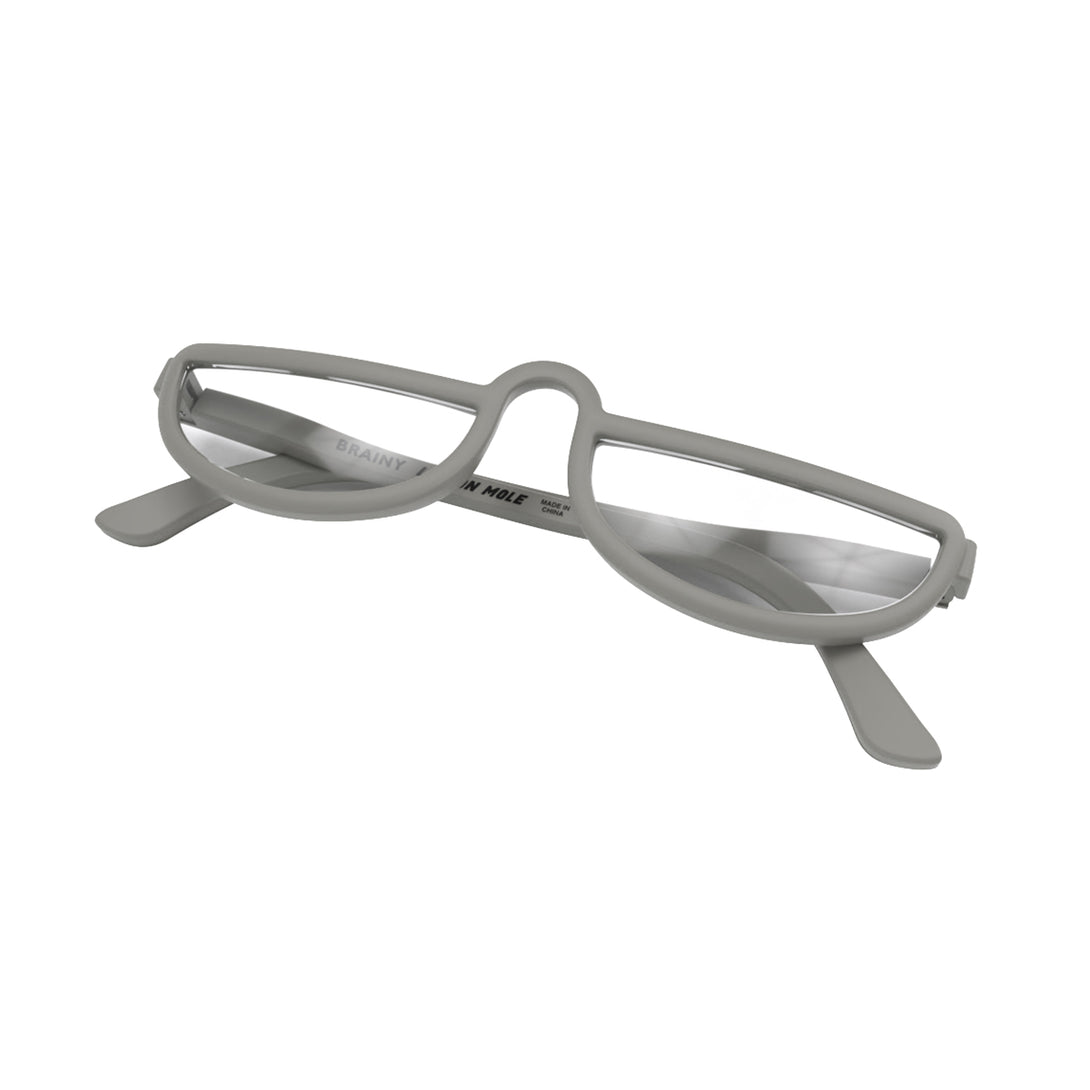 Closed skew - Brainy Reading Glasses in matt grey featuring an oversized circular frame and provide crystal clear vision. Available in a + 1, 1.5, 2, 2.5, 3 prescriptions.