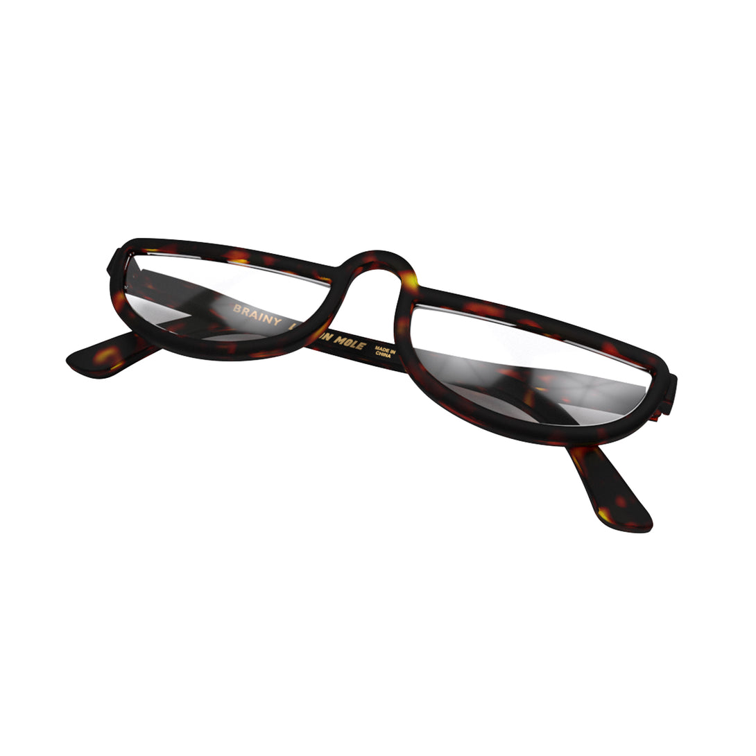 Closed skew - Brainy Reading Glasses in matt tortoiseshell featuring an oversized circular frame and provide crystal clear vision. Available in a + 1, 1.5, 2, 2.5, 3 prescriptions.