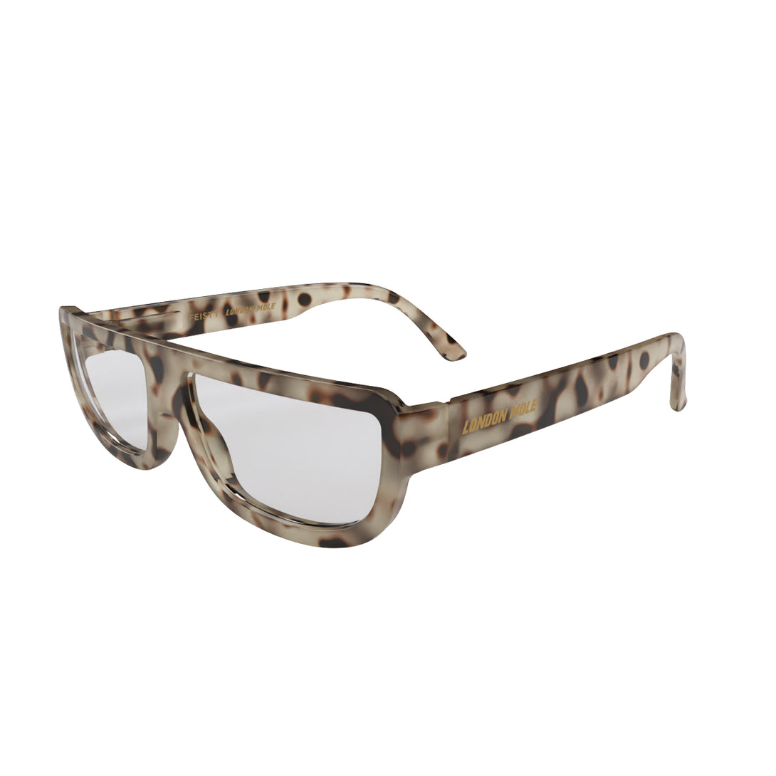 Open skew - Feisty Reading Glasses in pale tortoiseshell featuring a utilitarian, striaght top line frame and provide crystal clear vision. Available in a + 1, 1.5, 2, 2.5, 3 prescriptions.