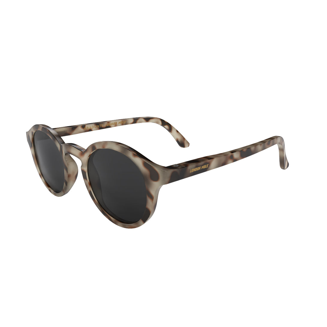 Open skew - Graduate sunglasses in pale tortoiseshell featuring a soft circle frame and black UV400 lenses. The finishing touch to every outfit while protecting your eyes. 