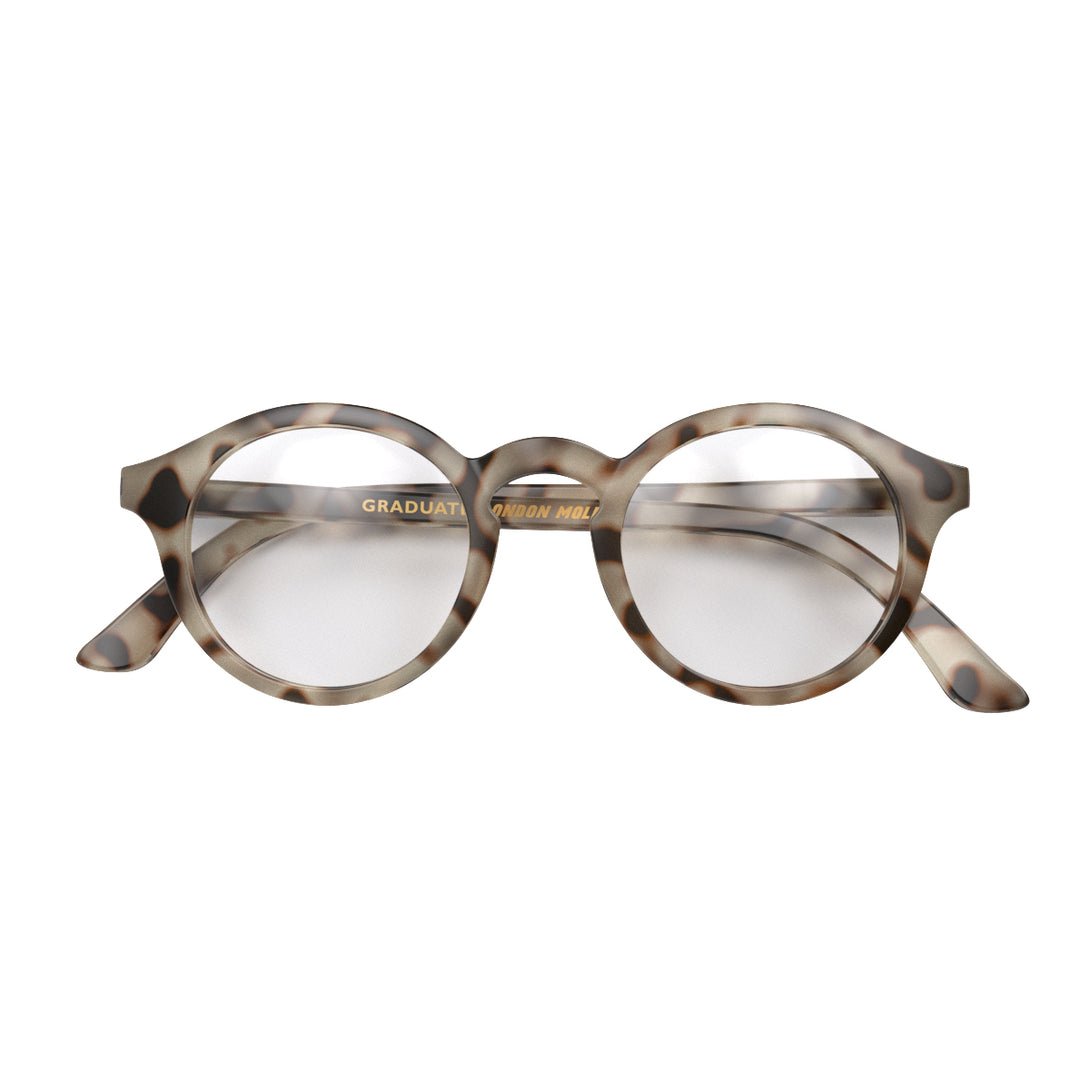 Front - Graduate Reading Glasses in pale tortoiseshell featuring a soft circle frame and provide crystal clear vision. Available in a + 1, 1.5, 2, 2.5, 3 prescriptions.