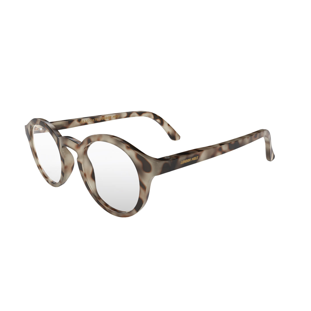 Open skew - Graduate Blue Blocker Glasses in pale tortoiseshell featuring a soft circle frame and the ability to protect your eyes from artificial blue light. Ideal for fashion accessories, screen time, office work, gaming, scrolling on a mobile, and watching TV. 
