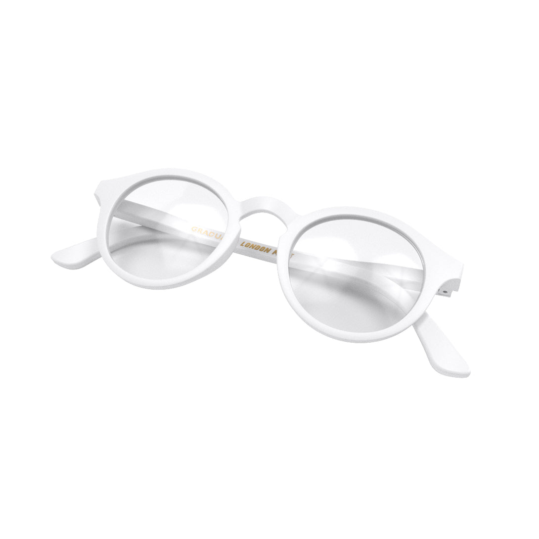 Folded skew - Graduate Reading Glasses in matt white featuring a soft circle frame and provide crystal clear vision. Available in a + 1, 1.5, 2, 2.5, 3 prescriptions.