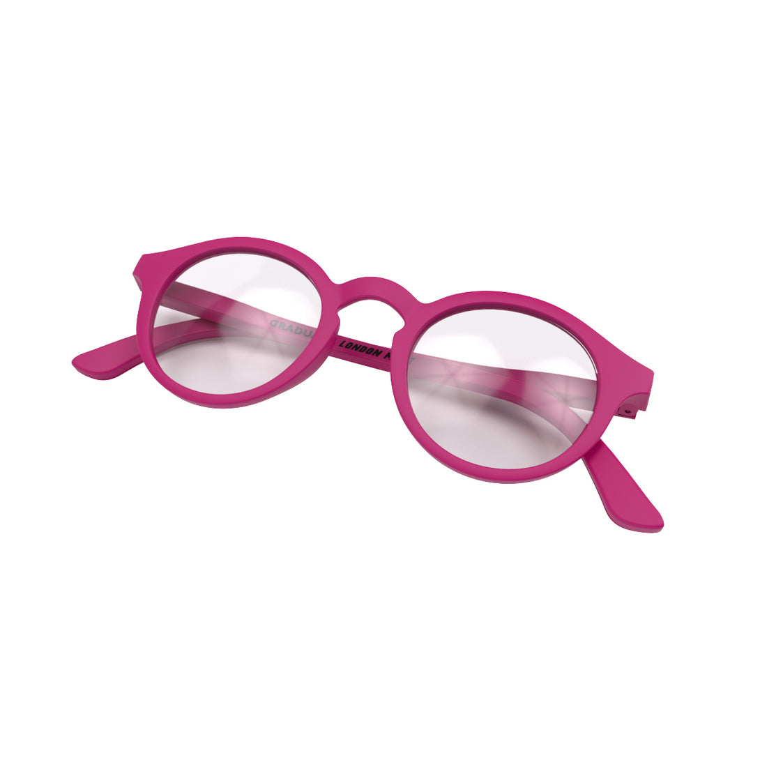 Folded skew - Graduate Reading Glasses in matt pink featuring a soft circle frame and provide crystal clear vision. Available in a + 1, 1.5, 2, 2.5, 3 prescriptions.