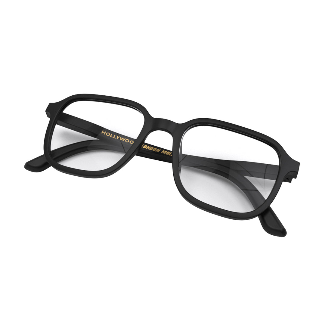 Closed skew - Hollywood Blue Blocker Glasses in matt black featuring a square, panto frame and the ability to protect your eyes from artificial blue light. Ideal for fashion accessories, screen time, office work, gaming, scrolling on a mobile, and watching TV. 