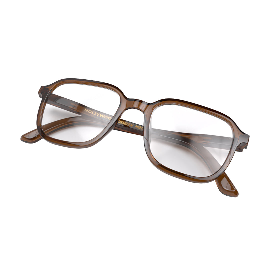 Folded skew - Hollywood Reading Glasses in transparent brown featuring a soft circle frame and provide crystal clear vision. Available in a + 1, 1.5, 2, 2.5, 3 prescriptions.