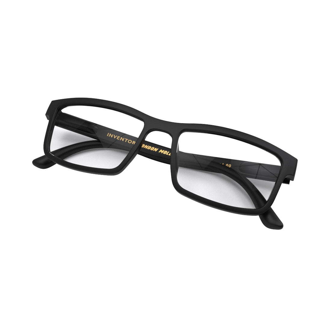 Folded skew - Inventor Reading Glasses in matt black featuring a classic rectangle frame made out of recycled materials and provide crystal clear vision. Available in a + 1, 1.5, 2, 2.5, 3 prescriptions.