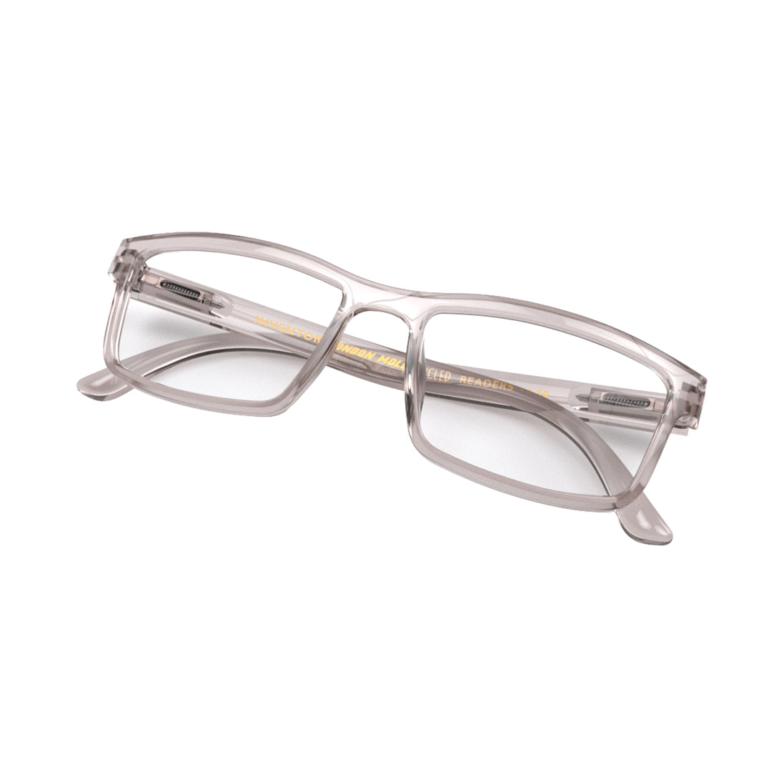 Folded skew - Inventor Reading Glasses in transparent grey featuring a classic rectangle frame made out of recycled materials and provide crystal clear vision. Available in a + 1, 1.5, 2, 2.5, 3 prescriptions.
