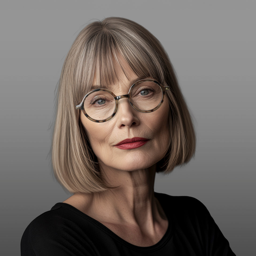 Female model - Artist Reading Glasses in pale tortoiseshell featuring an oversized circular frame and provide crystal clear vision. Available in a + 1, 1.5, 2, 2.5, 3 prescriptions.