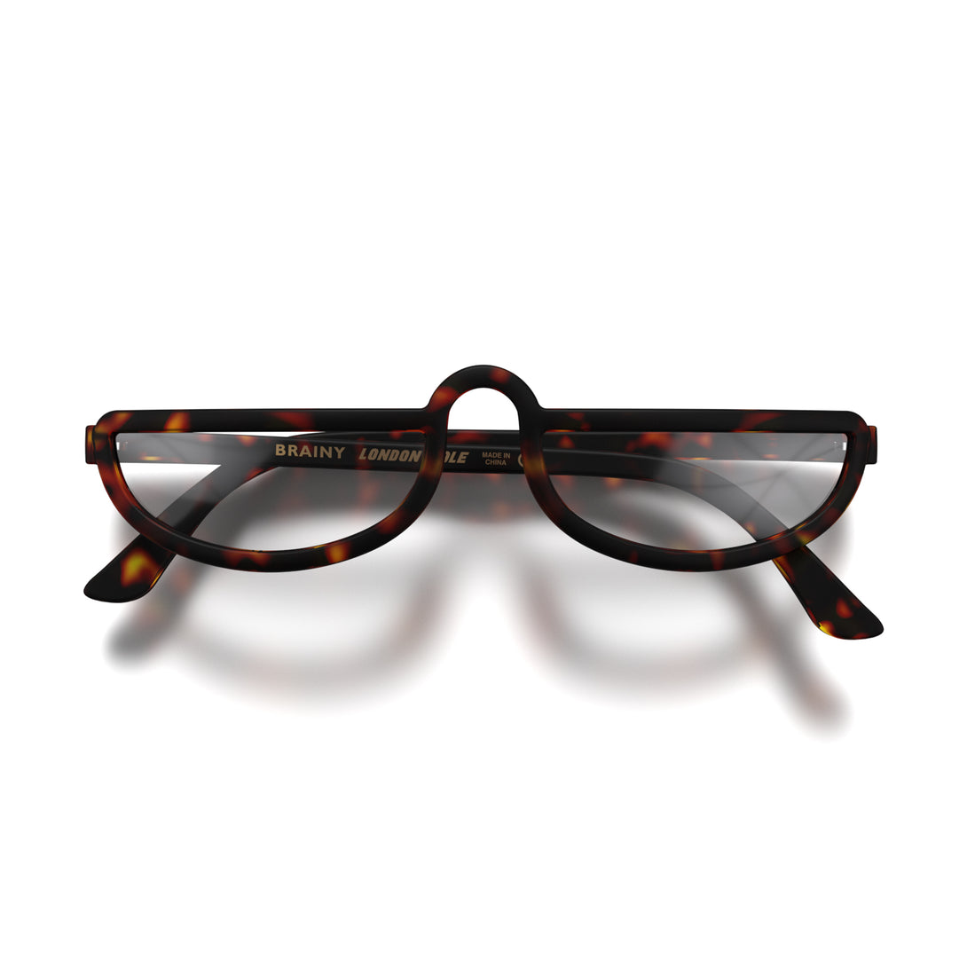 Front - Brainy Reading Glasses in matt tortoiseshell featuring an oversized circular frame and provide crystal clear vision. Available in a + 1, 1.5, 2, 2.5, 3 prescriptions.