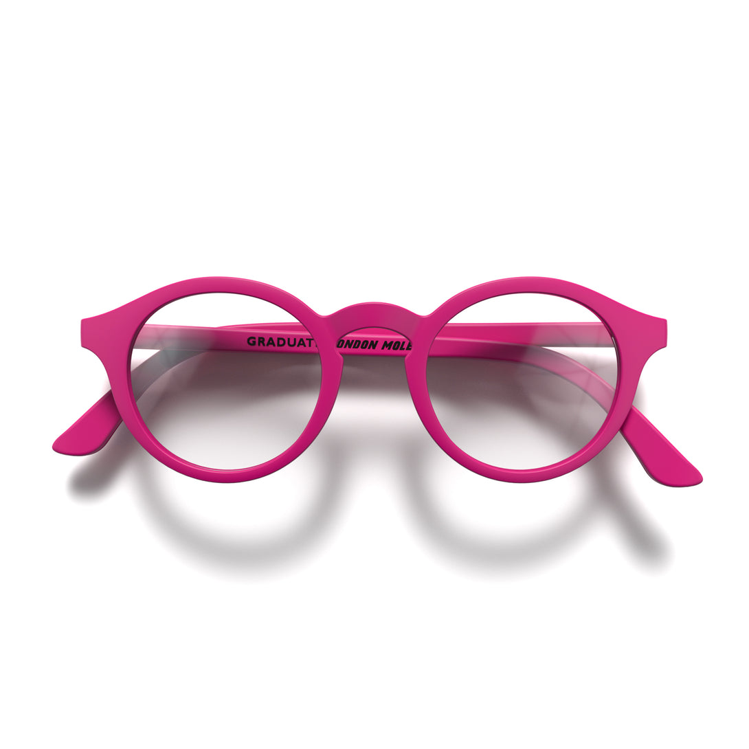 Front - Graduate Reading Glasses in matt pink featuring a soft circle frame and provide crystal clear vision. Available in a + 1, 1.5, 2, 2.5, 3 prescriptions.
