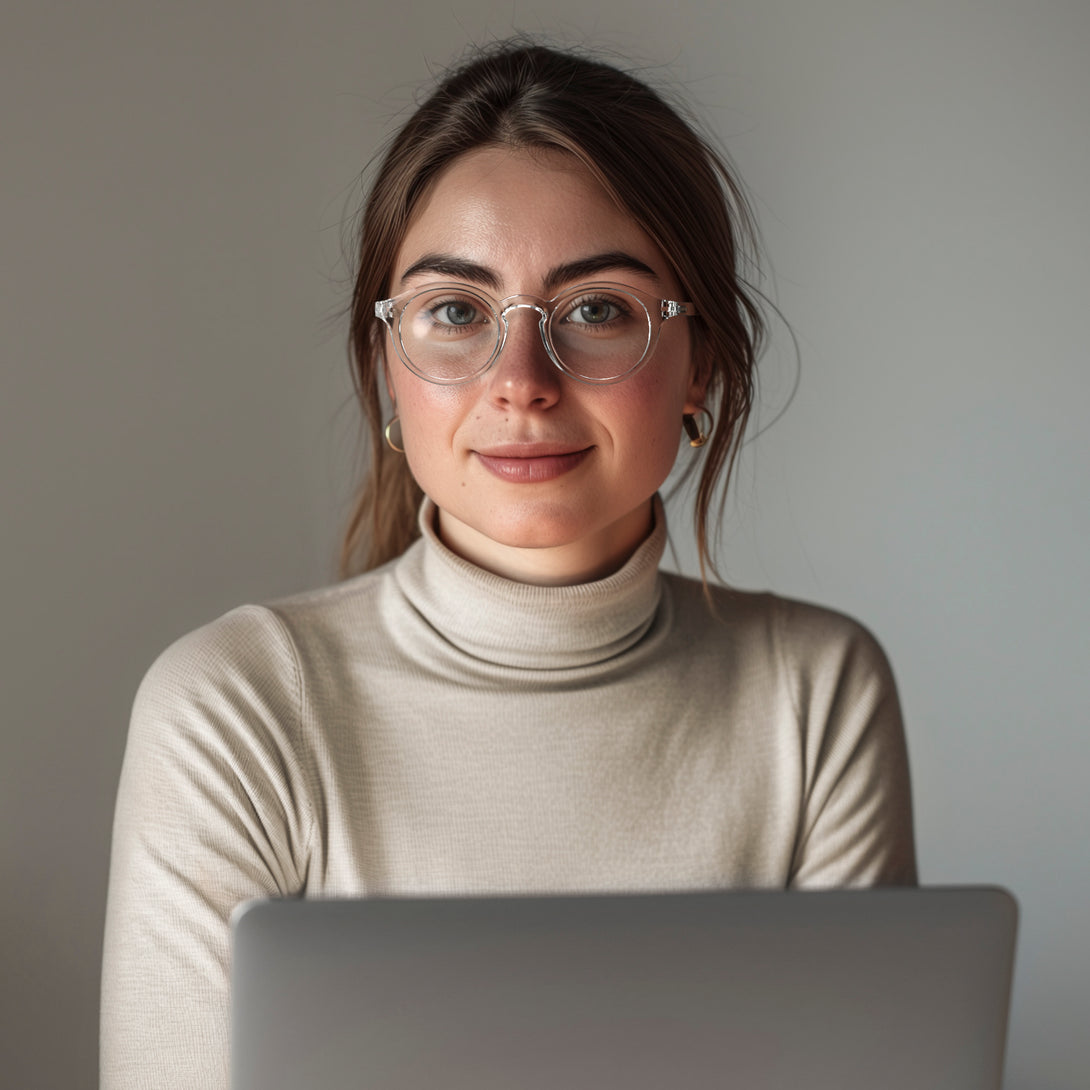 Female model - Graduate Blue Blocker Glasses featuring a soft circle transparent frame and the ability to protect your eyes from artificial blue light. Ideal for fashion accessories, screen time, office work, gaming, scrolling on a mobile, and watching TV. 