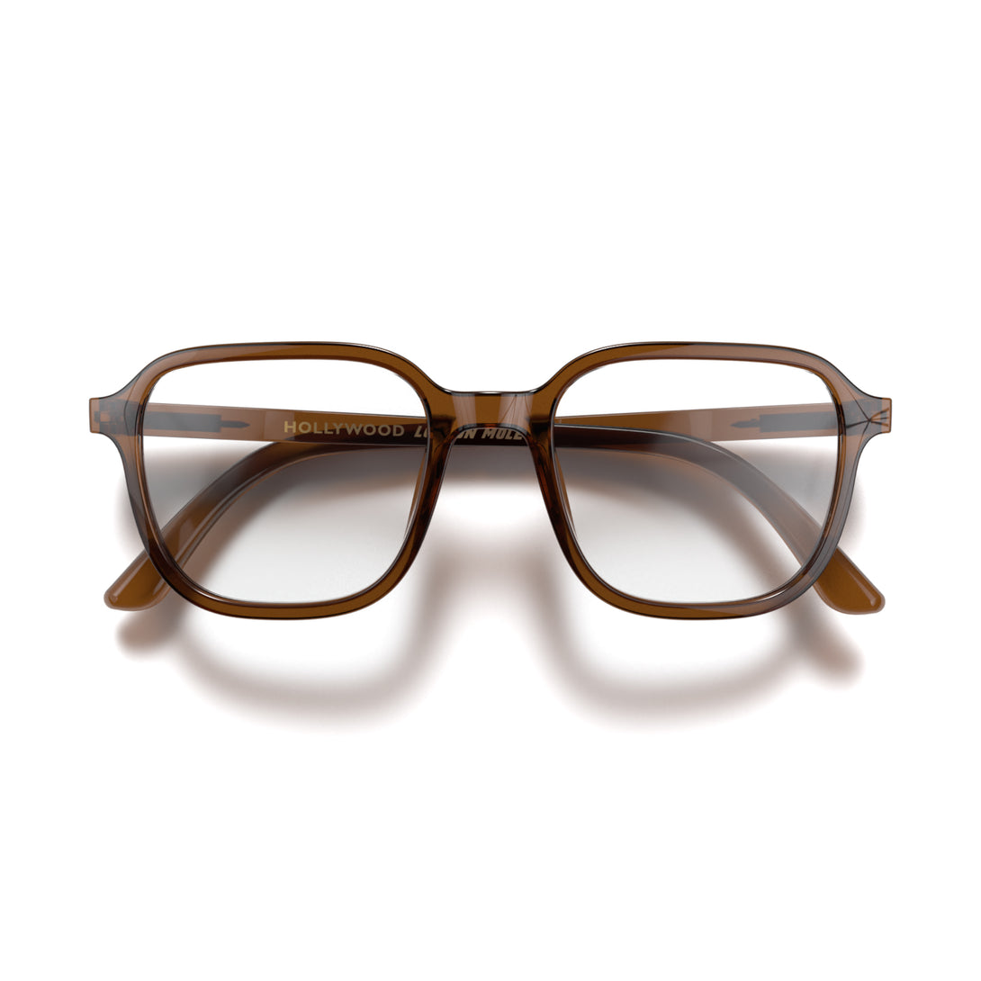 Front - Hollywood Reading Glasses in transparent brown featuring a soft circle frame and provide crystal clear vision. Available in a + 1, 1.5, 2, 2.5, 3 prescriptions.