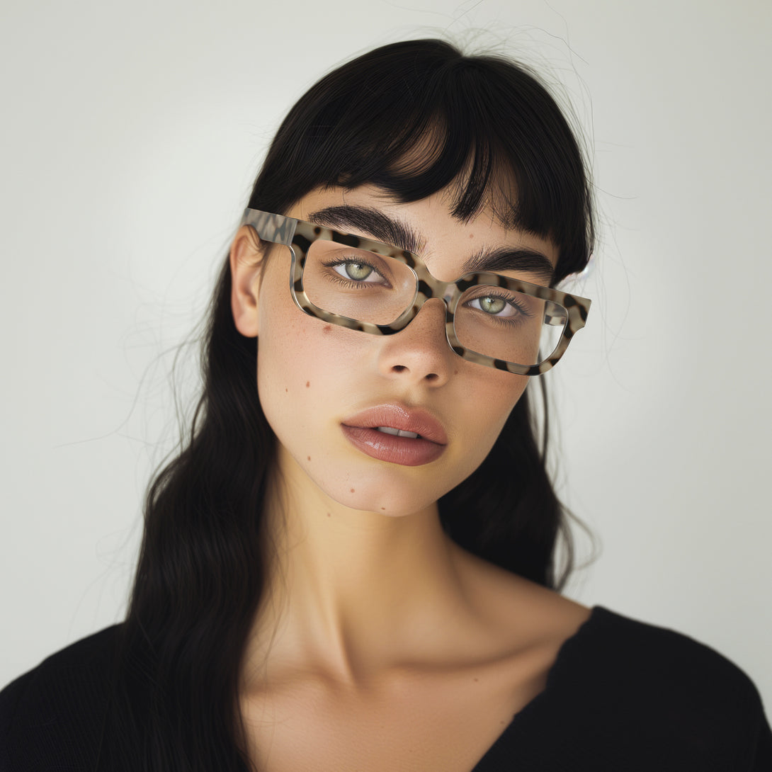Female model - Icy Reading Glasses in pale tortoiseshell featuring a bold rectangle frame and provide crystal clear vision. Available in a + 1, 1.5, 2, 2.5, 3 prescriptions.