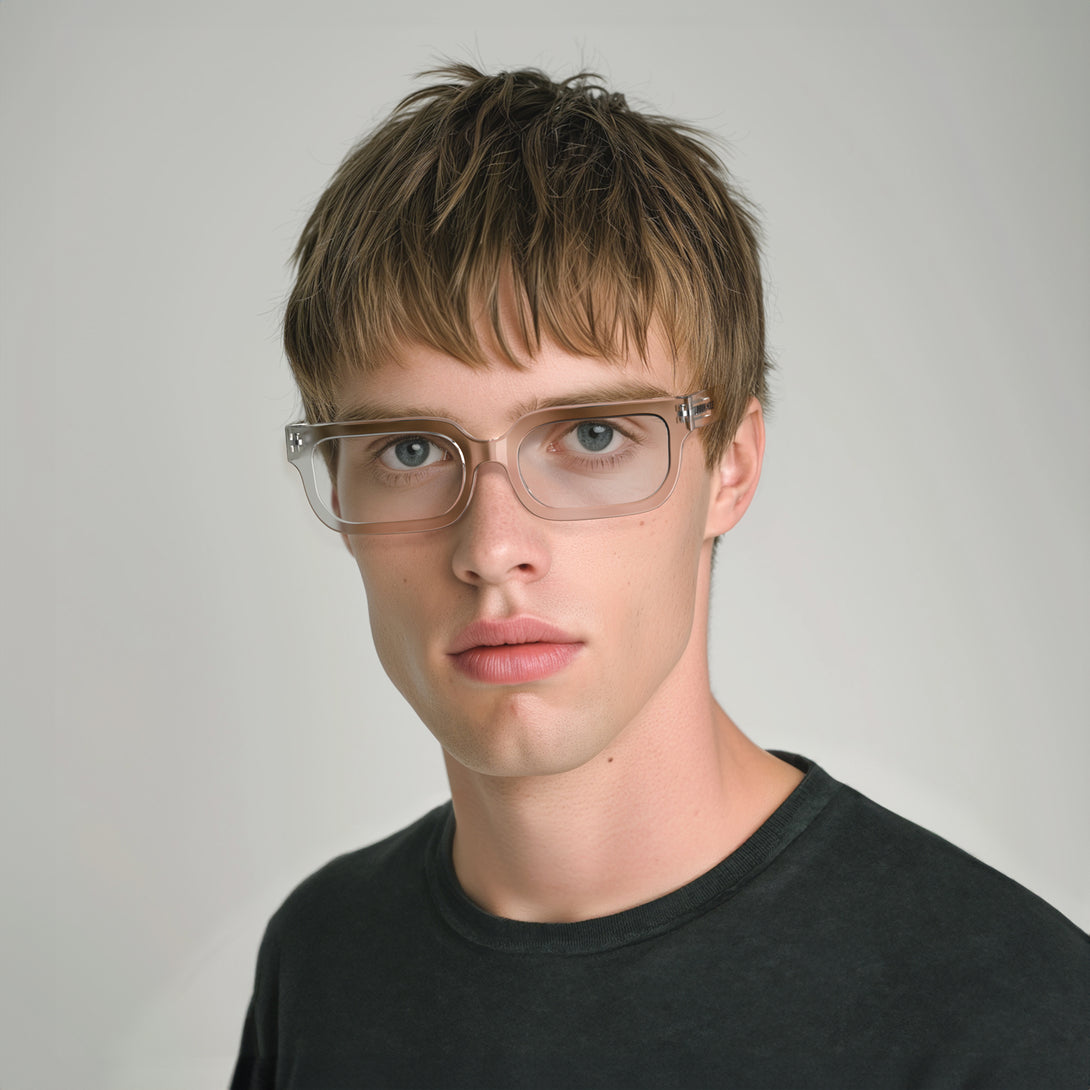 Male model  - Icy Reading Glasses featuring a bold rectangle, transparent frame and provide crystal clear vision. Available in a + 1, 1.5, 2, 2.5, 3 prescriptions.