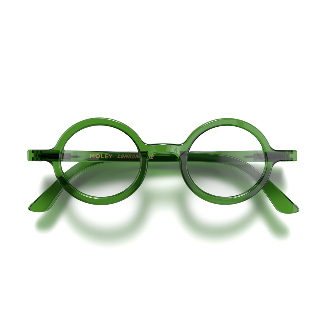 Front - Moley Reading Glasses in transparent green featuring an eccentrically round frame and provide crystal clear vision. Available in a + 1, 1.5, 2, 2.5, 3 prescriptions.