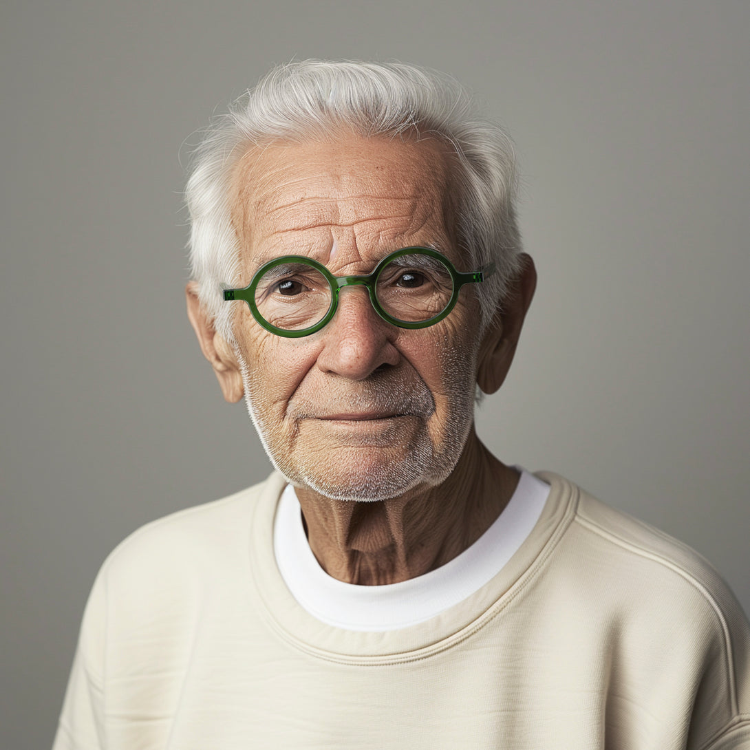 Male model - Moley Reading Glasses in transparent green featuring an eccentrically round frame and provide crystal clear vision. Available in a + 1, 1.5, 2, 2.5, 3 prescriptions.