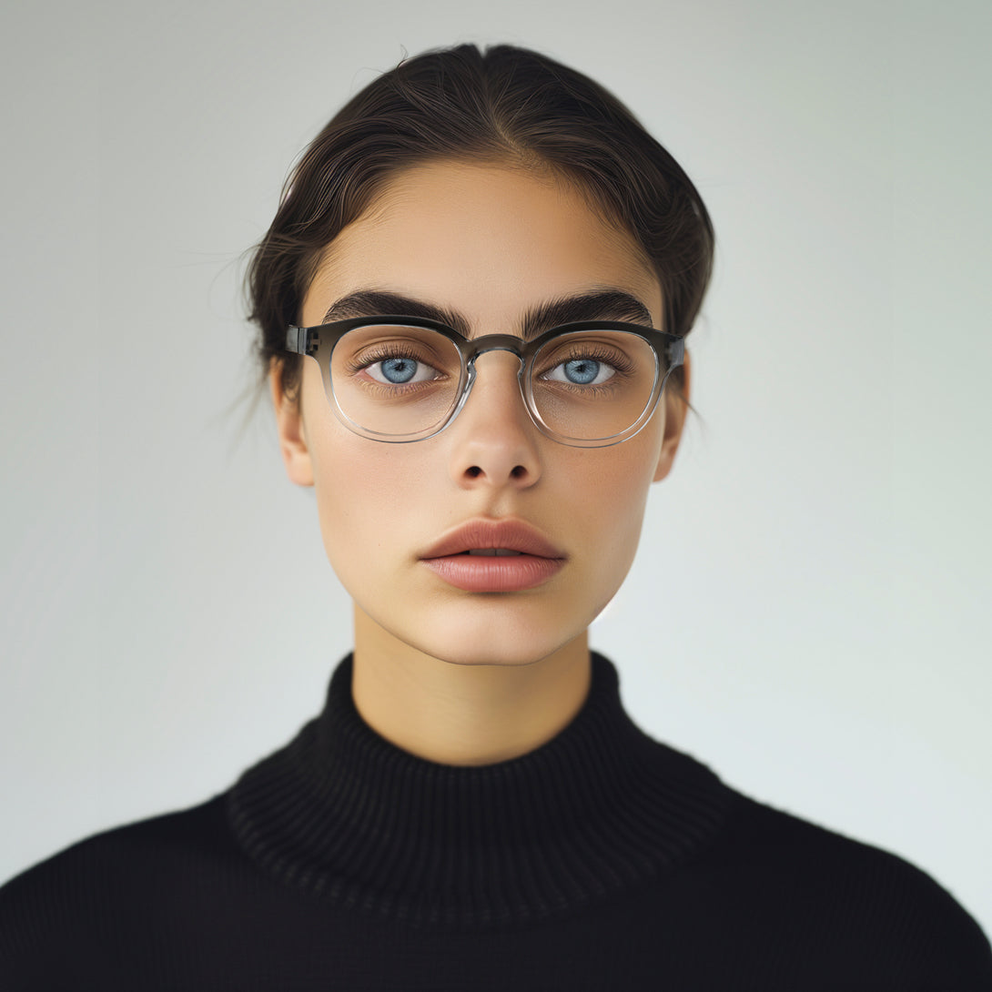 Female model - Monalux Blue Blocker Glasses in black fade featuring a the classic Oxford, rounded frame and the ability to protect your eyes from artificial blue light. Ideal for fashion accessories, screen time, office work, gaming, scrolling on a mobile, and watching TV. 
