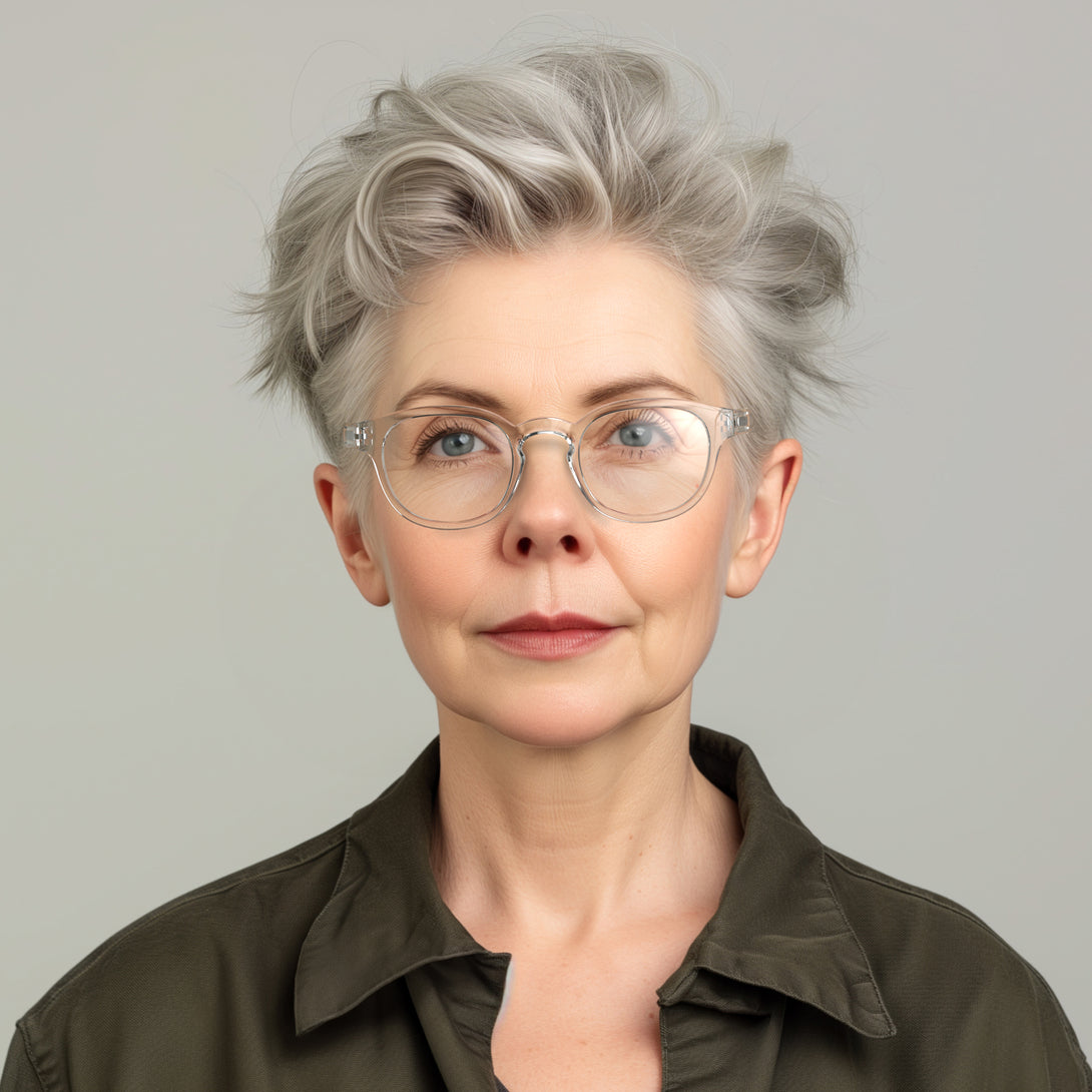 Female model -Monalux Blue Blocker Glasses featuring a the classic Oxford, rounded, transparent frame and the ability to protect your eyes from artificial blue light. Ideal for fashion accessories, screen time, office work, gaming, scrolling on a mobile, and watching TV. 