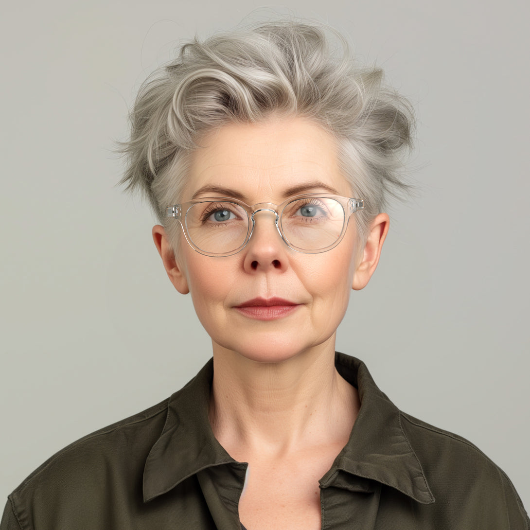 Female model - Monalux Reading Glasses featuring a the classic Oxford, rounded, transparent frame and provide crystal clear vision. Available in a + 1, 1.5, 2, 2.5, 3 prescriptions.