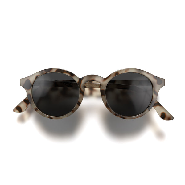 Front - Graduate sunglasses in pale tortoiseshell featuring a soft circle frame and black UV400 lenses. The finishing touch to every outfit while protecting your eyes. 