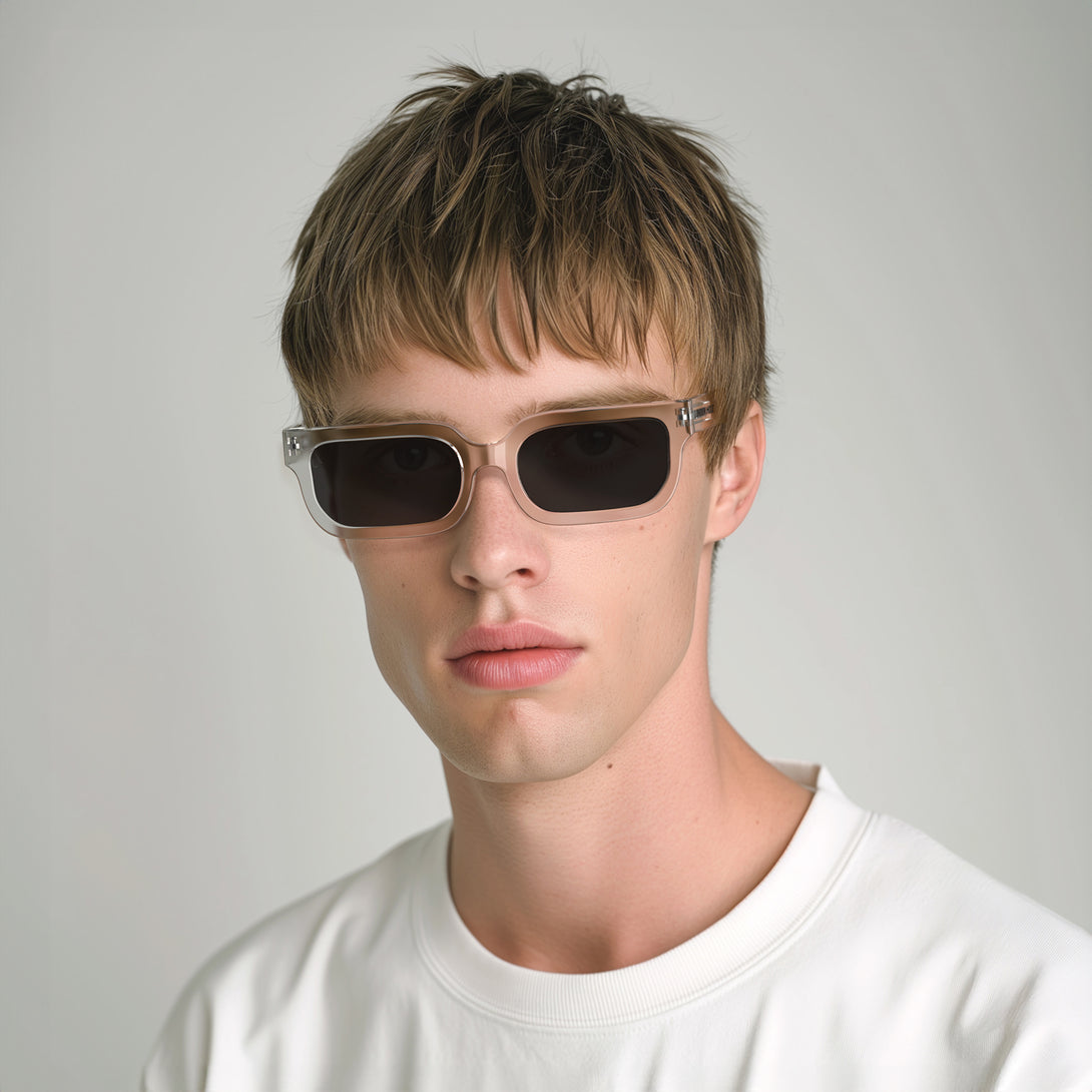 Male model - Icy sunglasses featuring a bold rectangle, transparent frame and black UV400 lenses. The finishing touch to every outfit while protecting your eyes. 