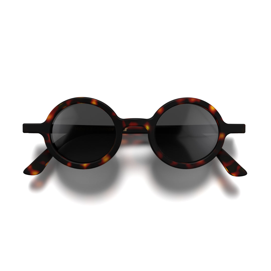 Front - Moly sunglasses matt tortoiseshell featuring an eccentrically round frame and black UV400 lenses. The perfect accessory.