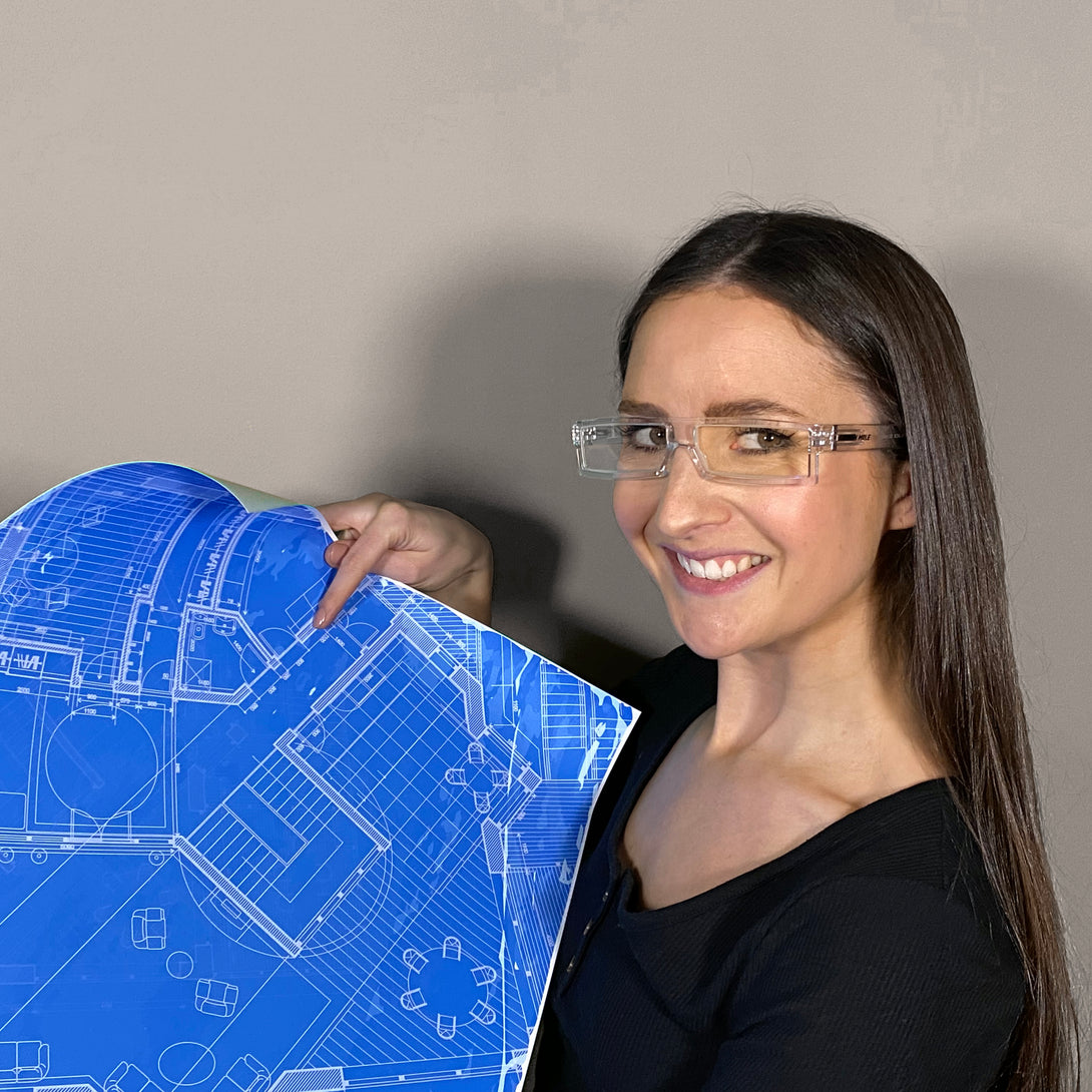 Female model - Spacey Blue Blocker Glasses in transparent featuring a modern rectangle frame with a utilitarian look and the ability to protect your eyes from artificial blue light. Ideal for fashion accessories, screen time, office work, gaming, scrolling on a mobile, and watching TV. 