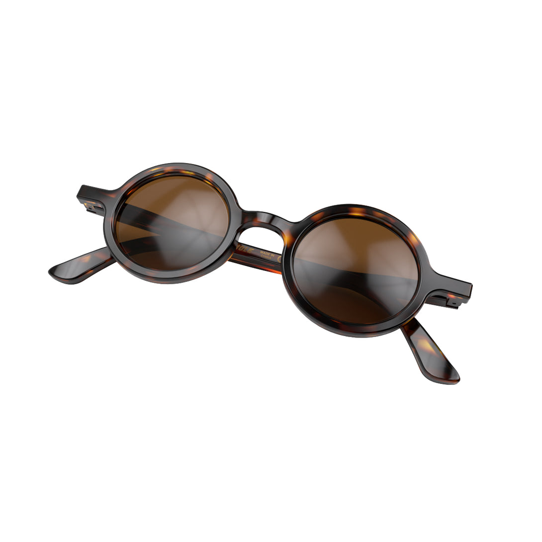 Folded skew - Moly sunglasses in gloss tortoiseshell featuring an eccentrically round frame and brown UV400 lenses. The perfect accessory.