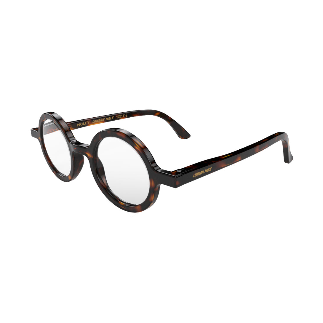 Open skew - Moley Reading Glasses in tortoisehsell featuring an eccentrically round frame and provide crystal clear vision. Available in a + 1, 1.5, 2, 2.5, 3 prescriptions.