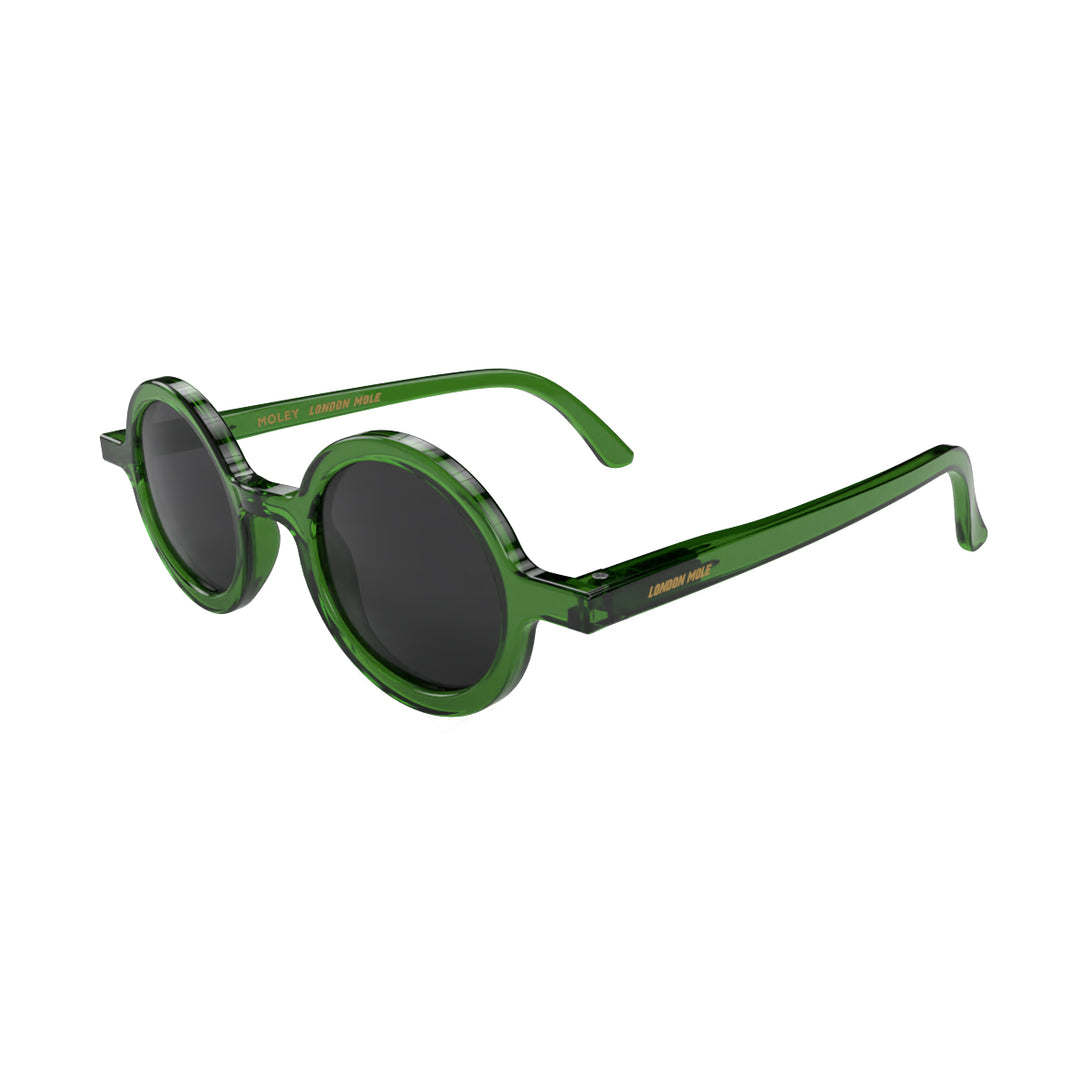 Open skew - Moly sunglasses transparent green featuring an eccentrically round frame and black UV400 lenses. The perfect accessory.