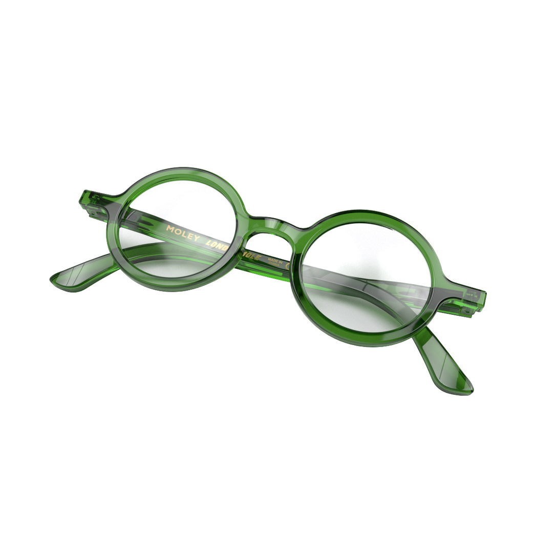 Folded skew - Moley Blue Blocker Glasses in transparent green featuring an eccentrically round frame and the ability to protect your eyes from artificial blue light. Ideal for fashion accessories, screen time, office work, gaming, scrolling on a mobile, and watching TV. 