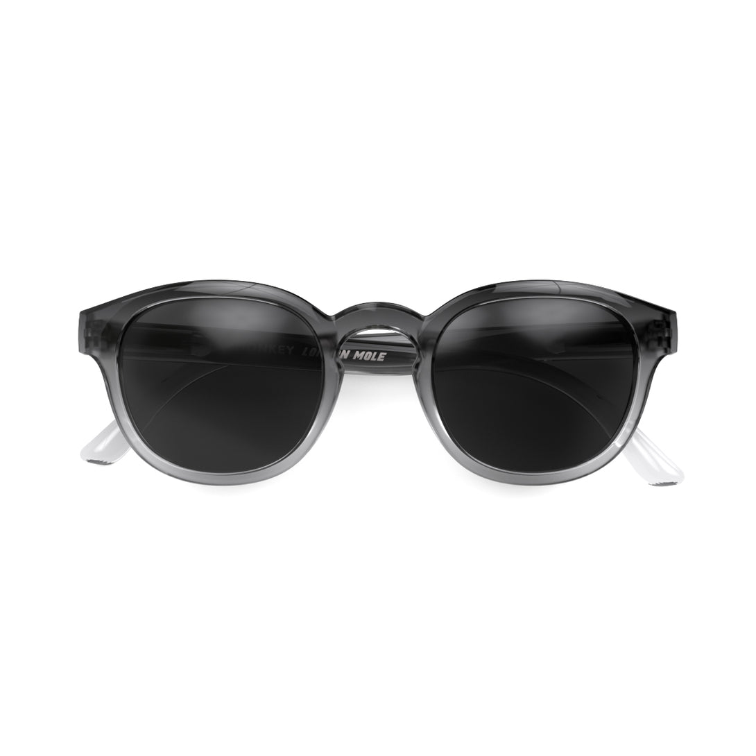 Front - Monalux sunglasses in black fade featuring a the classic Oxford, rounded frame and black UV400 lenses. The perfect accessory.