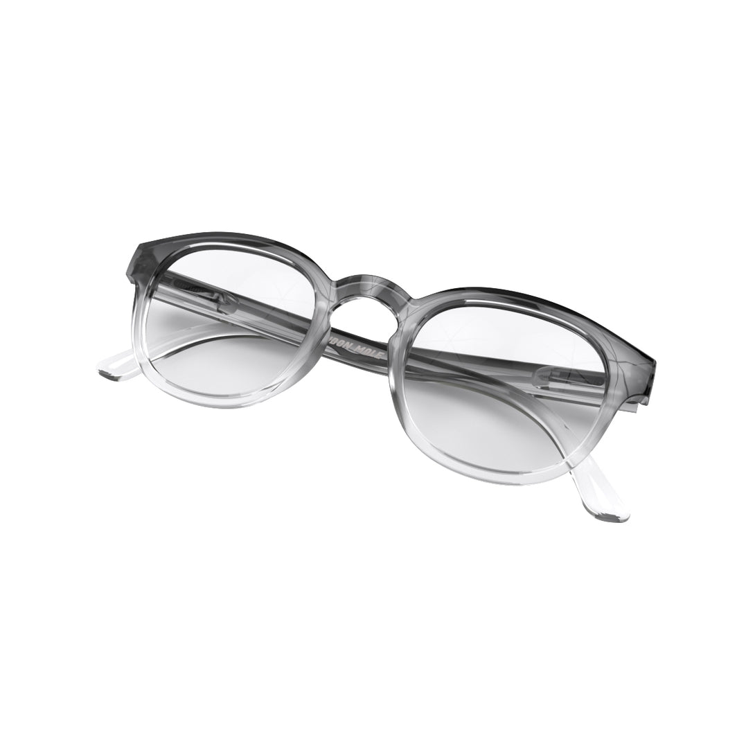Folded skew - Monalux Blue Blocker Glasses in black fade featuring a the classic Oxford, rounded frame and the ability to protect your eyes from artificial blue light. Ideal for fashion accessories, screen time, office work, gaming, scrolling on a mobile, and watching TV. 
