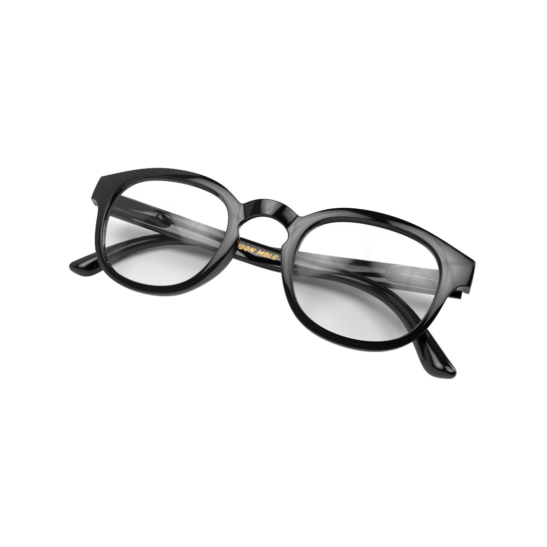 Folded skew - Monalux Blue Blocker Glasses in gloss black featuring a the classic Oxford, rounded frame and the ability to protect your eyes from artificial blue light. Ideal for fashion accessories, screen time, office work, gaming, scrolling on a mobile, and watching TV. 