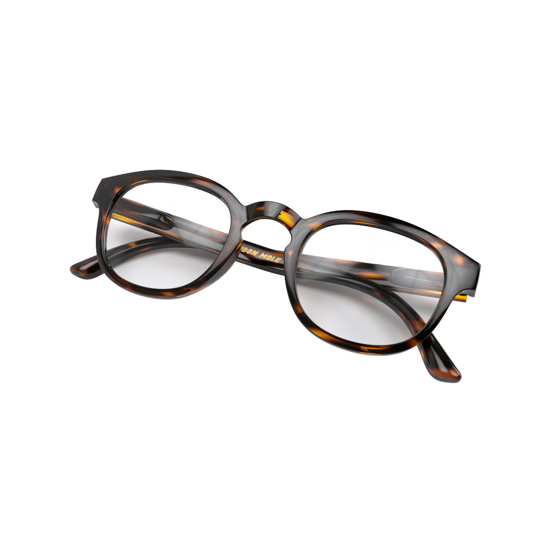 Folded skew - Monalux Blue Blocker Glasses in gloss tortoiseshell featuring a the classic Oxford, rounded frame and the ability to protect your eyes from artificial blue light. Ideal for fashion accessories, screen time, office work, gaming, scrolling on a mobile, and watching TV. 