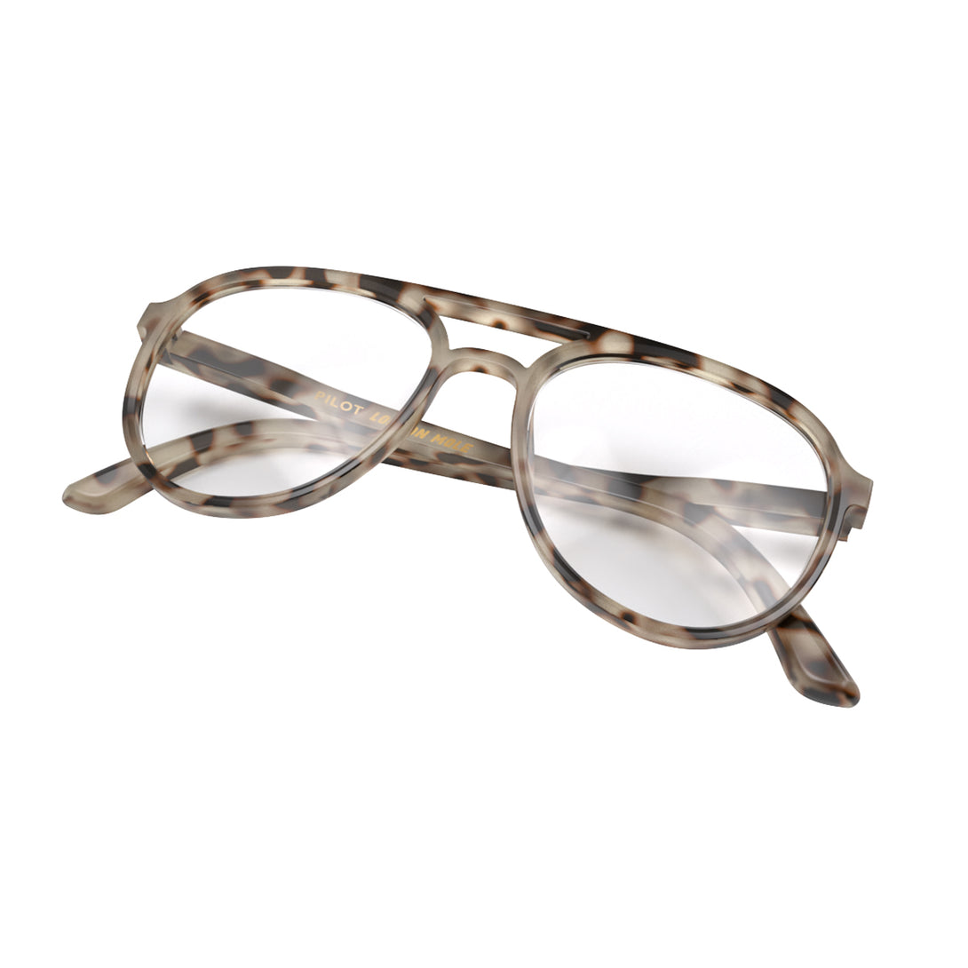 Folded skew - Pilot Reading Glasses in pale tortoiseshell featuring the staple aviator frame and provide crystal clear vision. Available in a + 1, 1.5, 2, 2.5, 3 prescriptions.