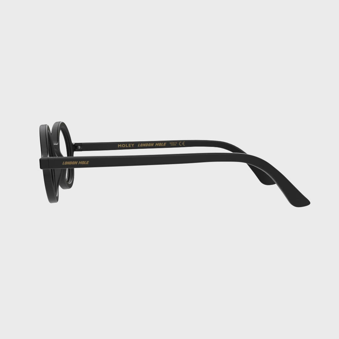 360 Turning Animation - Moley Reading Glasses in matt black featuring an eccentrically round frame and provide crystal clear vision. Available in a + 1, 1.5, 2, 2.5, 3 prescriptions.