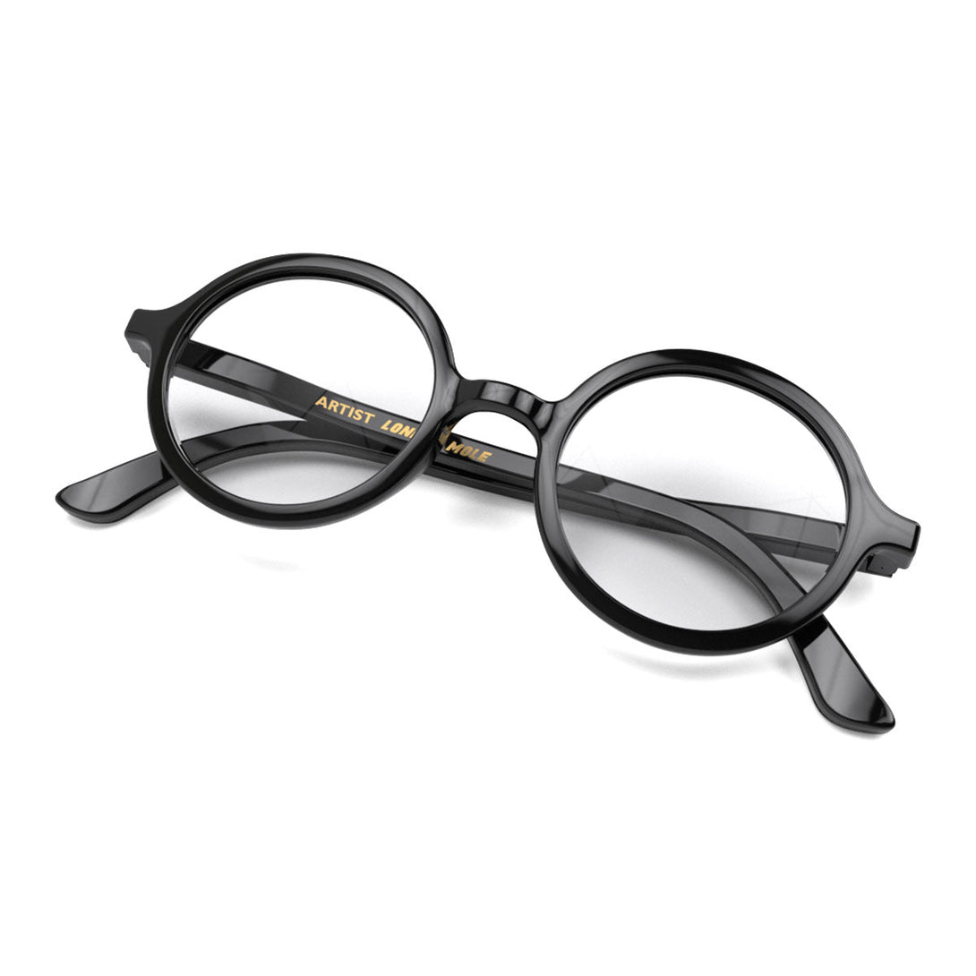 Skew - Artist Reading Glasses in gloss black featuring an oversized circular frame and provide crystal clear vision. Available in a + 1, 1.5, 2, 2.5, 3 prescriptions.