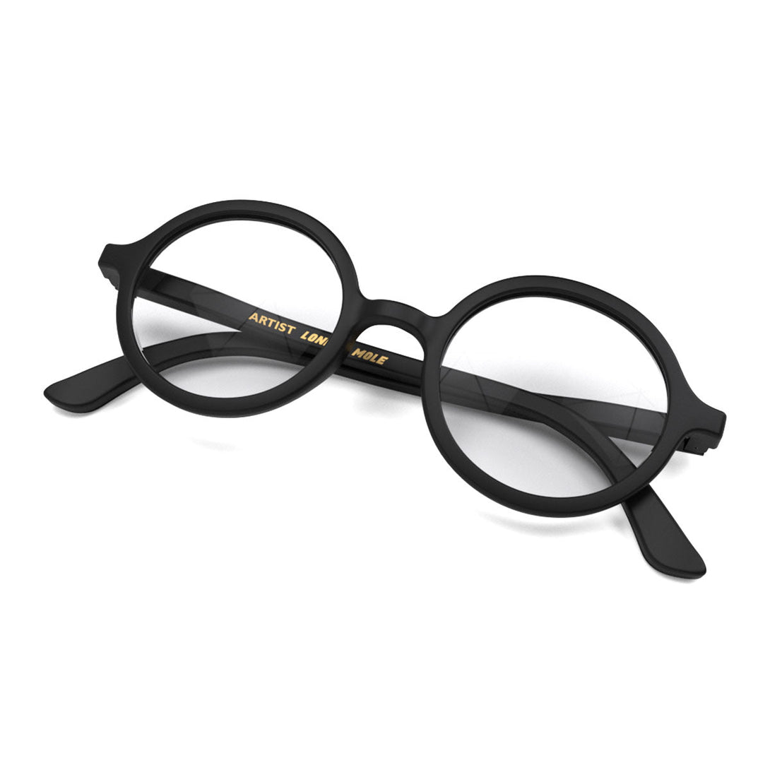 Skew 2 - Artist Blue Blocker Glasses in matt black featuring an oversized circular frame and the ability to protect your eyes from artificial blue light. Ideal for fashion accessories, screen time, office work, gaming, scrolling on a mobile, and watching TV. 