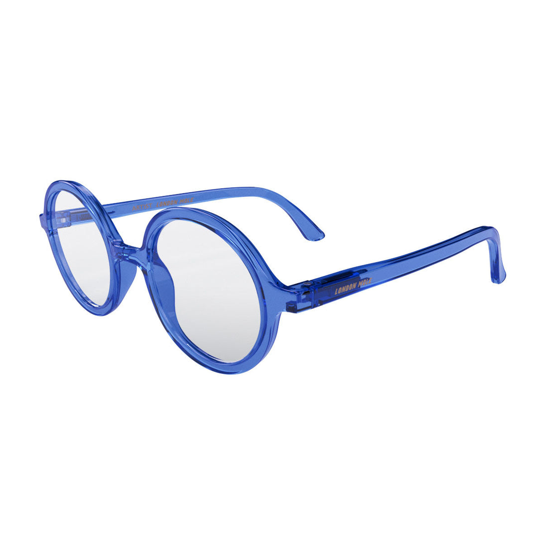 Skew 2 - Artist Reading Glasses in transparent blue featuring an oversized circular frame and provide crystal clear vision. Available in a + 1, 1.5, 2, 2.5, 3 prescriptions.