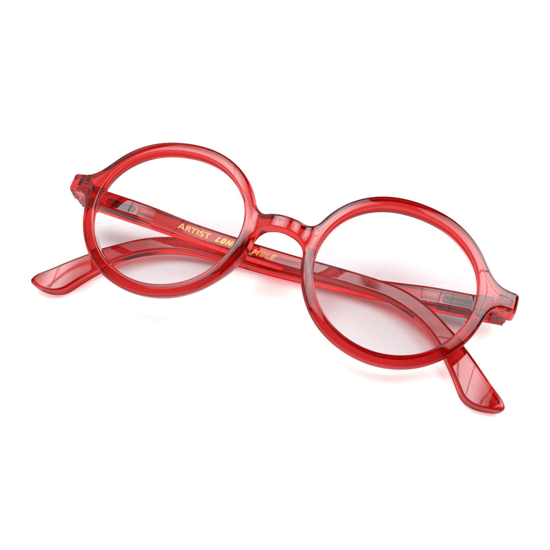 Skew 2 - Artist Blue Blocker Glasses in transparent red featuring an oversized circular frame and the ability to protect your eyes from artificial blue light. Ideal for fashion accessories, screen time, office work, gaming, scrolling on a mobile, and watching TV. 