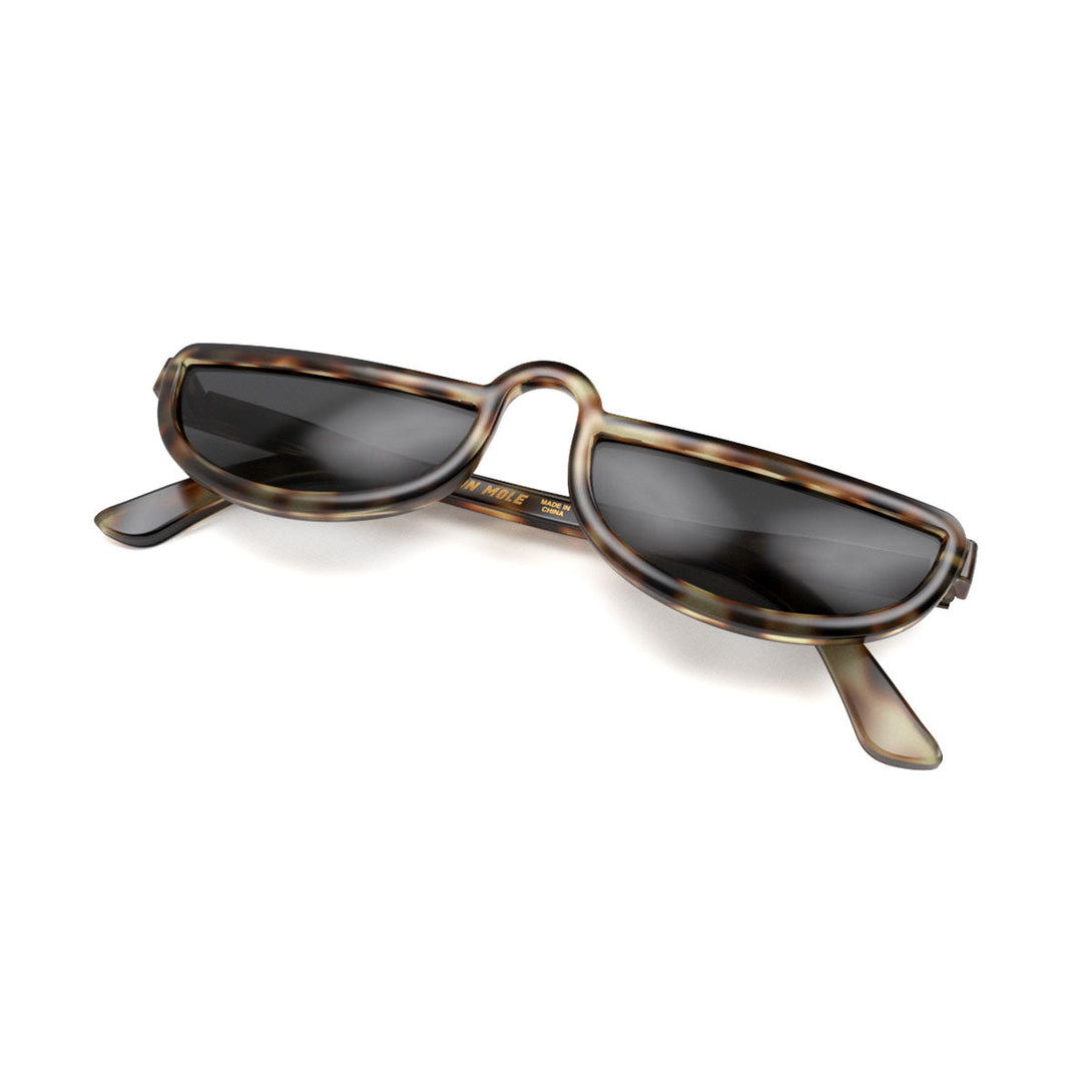 Closed skew - Brainy sunglasses in pale tortoiseshell featuring a half-moon frame and black UV400 lenses. The finishing touch to every outfit while protecting your eyes. 