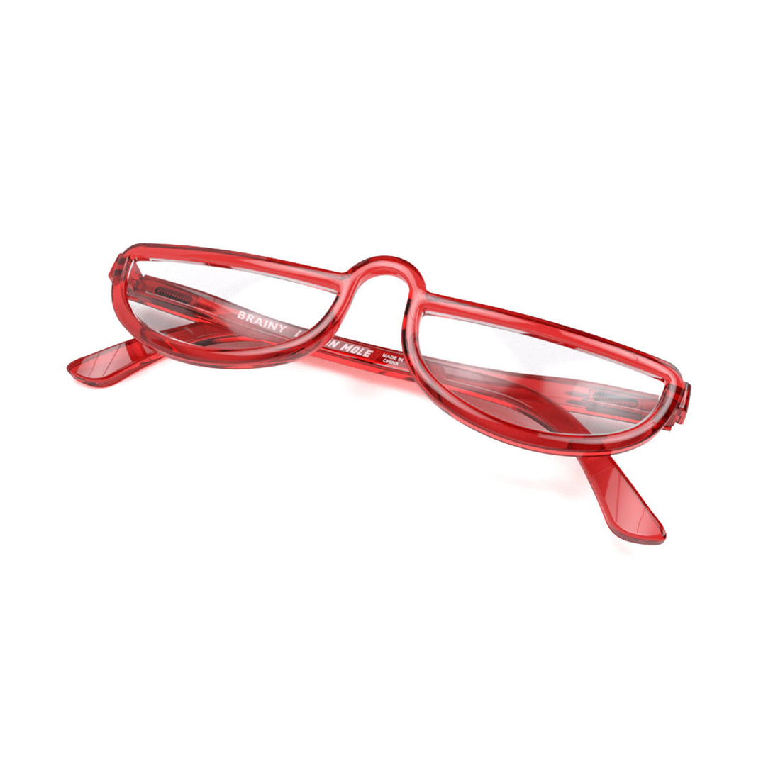 Closed skew - Brainy Reading Glasses in transparent red featuring a half-moon frame and provide crystal clear vision. Available in a + 1, 1.5, 2, 2.5, 3 prescriptions.
