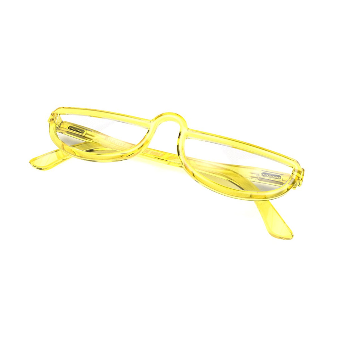 Closed skew - Brainy Blue Blocker Glasses in transparent yellow featuring a half-moon frame and the ability to protect your eyes from artificial blue light. Ideal for fashion accessories, screen time, office work, gaming, scrolling on a mobile, and watching TV. 