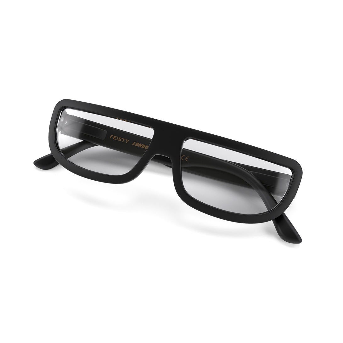 Closed skew - Feisty Blue Blocker Glasses in matt black featuring a half-moon frame and the ability to protect your eyes from artificial blue light. Ideal for fashion accessories, screen time, office work, gaming, scrolling on a mobile, and watching TV. 