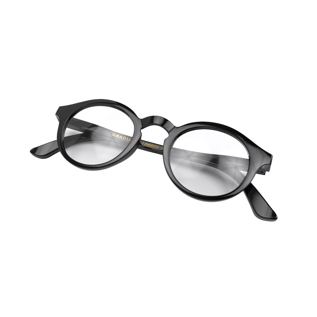 Folded Skew - Graduate Reading Glasses in gloss black featuring a soft circle frame and provide crystal clear vision. Available in a + 1, 1.5, 2, 2.5, 3 prescriptions.