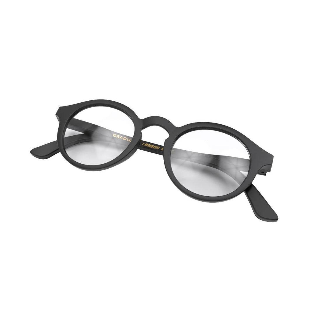 Folded Skew - Graduate Blue Blocker Glasses in matt black featuring a soft circle frame and the ability to protect your eyes from artificial blue light. Ideal for fashion accessories, screen time, office work, gaming, scrolling on a mobile, and watching TV. 