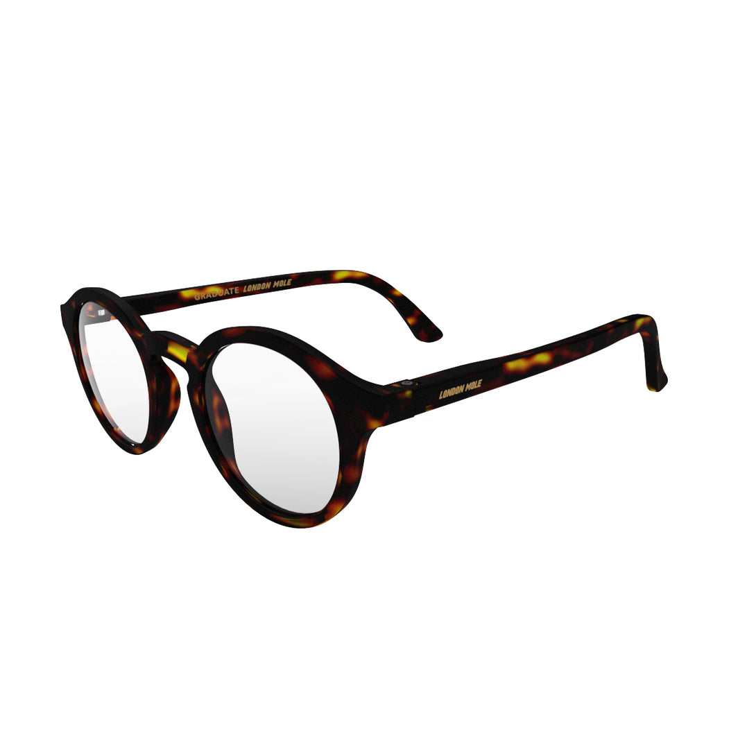 Open skew - Graduate Blue Blocker Glasses in matt tortoiseshell featuring a soft circle frame and the ability to protect your eyes from artificial blue light. Ideal for fashion accessories, screen time, office work, gaming, scrolling on a mobile, and watching TV. 