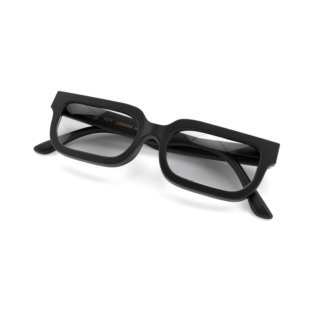 Folded skew - Icy Reading Glasses in matt black featuring a bold rectangle frame and provide crystal clear vision. Available in a + 1, 1.5, 2, 2.5, 3 prescriptions.